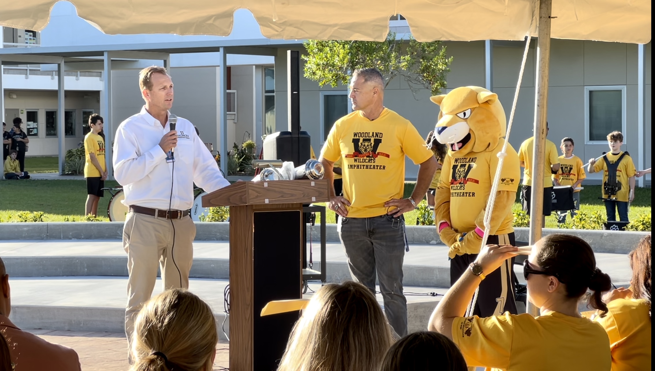 Tom Rees, VP Halfacre Construction, address crowd during Woodland Middle Amphitheater Ribbon Cutting